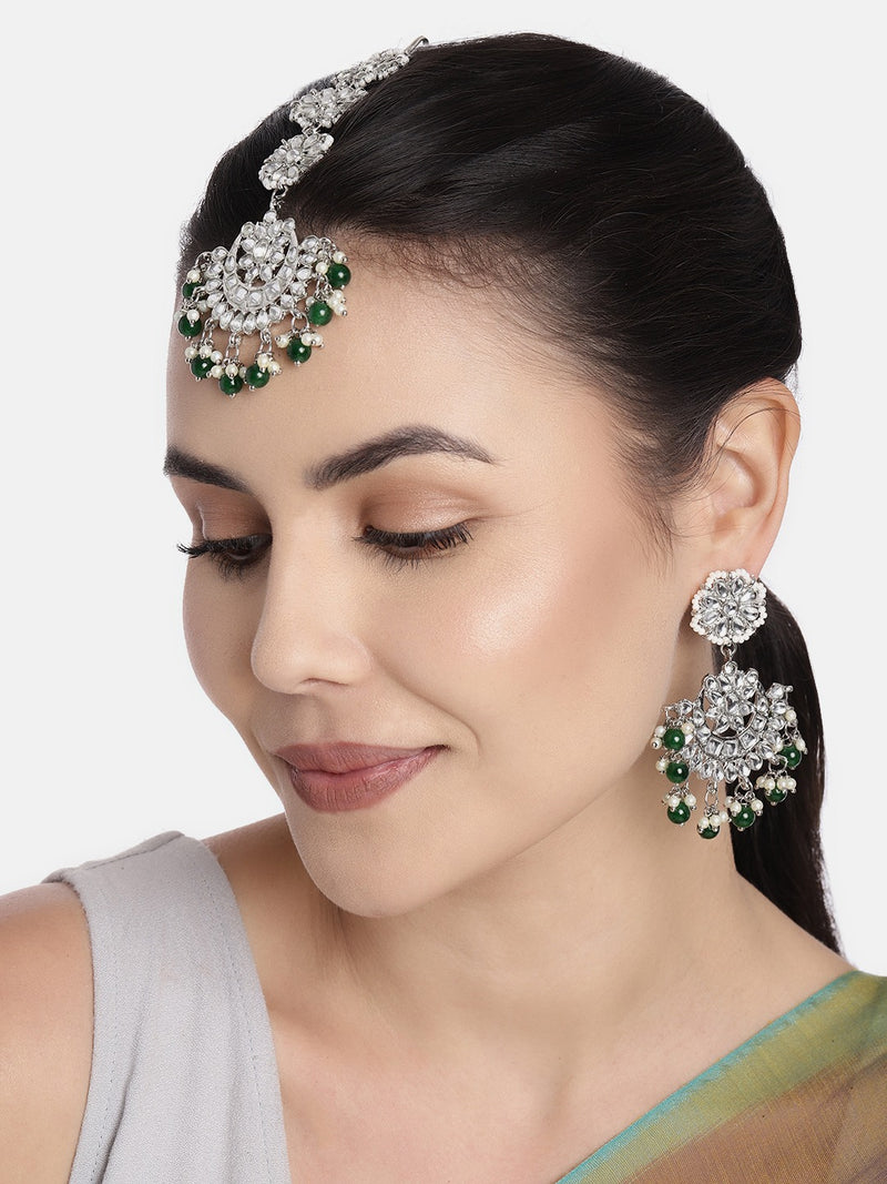 This fancy design kundan maang tikka with earrings set is crafted with –  Look Ethnic
